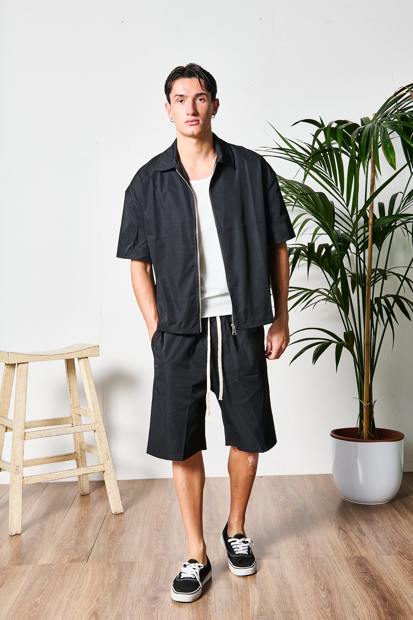 COMPLETO ZIP NERO BERMUDA